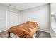 Secondary bedroom with a double bed and built-in closet at 11654 Stone Pine St, Riverview, FL 33569