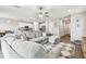 Spacious living room with a sectional sofa and a large TV at 11654 Stone Pine St, Riverview, FL 33569