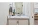 Small powder room with a pedestal sink and white cabinets at 11654 Stone Pine St, Riverview, FL 33569