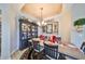 Bright dining room featuring a formal table, chandelier, and built-in hutch at 1356 Emerald Dunes Dr, Sun City Center, FL 33573