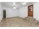 Spacious basement with tiled floors, multiple doors, and ceiling fans at 1619 E Nome St, Tampa, FL 33604