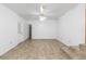 Large basement area with tiled floor and ceiling fan at 1619 E Nome St, Tampa, FL 33604