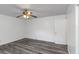 Simple bedroom with grey vinyl flooring, ceiling fan and closet at 1619 E Nome St, Tampa, FL 33604