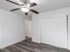 Bedroom with gray flooring, white walls, and ceiling fan at 1619 E Nome St, Tampa, FL 33604
