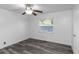 Bright bedroom with gray vinyl flooring and ceiling fan at 1619 E Nome St, Tampa, FL 33604
