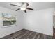 Well lit bedroom with window, closet, and ceiling fan at 1619 E Nome St, Tampa, FL 33604