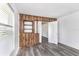 Simple dining room with wood wall accents and grey flooring at 1619 E Nome St, Tampa, FL 33604