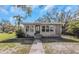 Ranch-style house with a landscaped yard at 1619 E Nome St, Tampa, FL 33604