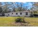 Ranch-style house with a large yard at 1619 E Nome St, Tampa, FL 33604