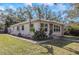 Charming ranch-style home with a well-maintained lawn at 1619 E Nome St, Tampa, FL 33604