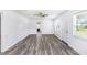 Spacious living room featuring hardwood floors and lots of natural light at 1619 E Nome St, Tampa, FL 33604