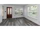 Bright living room featuring grey flooring and large windows at 1619 E Nome St, Tampa, FL 33604