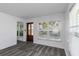 Bright living room featuring grey flooring and large windows at 1619 E Nome St, Tampa, FL 33604