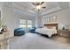 Main bedroom with carpeted floors and ceiling fan at 17219 Scuba Crest St, Wimauma, FL 33598