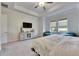 Bedroom with large window, TV stand and comfortable seating at 17219 Scuba Crest St, Wimauma, FL 33598