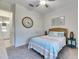 Cozy bedroom with a full-size bed and coastal-themed decor at 17219 Scuba Crest St, Wimauma, FL 33598