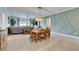 Dining room with wood table and chairs, view into living room and kitchen at 17219 Scuba Crest St, Wimauma, FL 33598