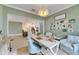 Bright home office features built-in shelving and view into kitchen at 17219 Scuba Crest St, Wimauma, FL 33598