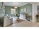 Light and airy home office with two armchairs and a desk at 17219 Scuba Crest St, Wimauma, FL 33598