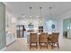 Open concept kitchen with island and breakfast bar at 17219 Scuba Crest St, Wimauma, FL 33598
