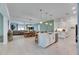 Open kitchen with island, breakfast bar, and view of dining area at 17219 Scuba Crest St, Wimauma, FL 33598