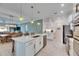 Open kitchen with island and breakfast bar at 17219 Scuba Crest St, Wimauma, FL 33598