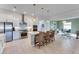 Open concept kitchen with island and seating at 17219 Scuba Crest St, Wimauma, FL 33598