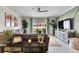Living room with sectional sofa, sliding glass doors, and backyard view at 17219 Scuba Crest St, Wimauma, FL 33598