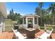 Deck with gazebo, fire pit, and grill, perfect for entertaining at 1742 Bayshore Blvd, Dunedin, FL 34698