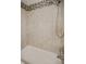 Clean bathroom with tub and shower, accented with mosaic tiles at 1742 Bayshore Blvd, Dunedin, FL 34698