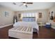 Bright bedroom featuring a king-size bed and hardwood floors at 1742 Bayshore Blvd, Dunedin, FL 34698