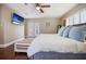 Main bedroom with king bed, hardwood floors, and access to patio at 1742 Bayshore Blvd, Dunedin, FL 34698