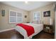 Guest bedroom with queen bed and hardwood floors at 1742 Bayshore Blvd, Dunedin, FL 34698