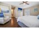 Bedroom with king bed, hardwood floors, and access to bathroom at 1742 Bayshore Blvd, Dunedin, FL 34698