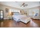 Spacious bedroom with king-size bed, ample natural light, and hardwood floors at 1742 Bayshore Blvd, Dunedin, FL 34698