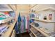 Walk-in closet with organized shelving and hanging space at 1742 Bayshore Blvd, Dunedin, FL 34698