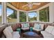 Screened gazebo with seating area, offering a relaxing outdoor space at 1742 Bayshore Blvd, Dunedin, FL 34698