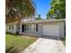 Single-story home with gray exterior and landscaping at 1742 Bayshore Blvd, Dunedin, FL 34698