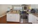 Well-equipped kitchen with stainless steel appliances and granite countertops at 1742 Bayshore Blvd, Dunedin, FL 34698