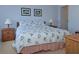 Serene bedroom with a queen-size bed and coastal-themed bedding at 2637 Barksdale Ct # 2637, Clearwater, FL 33761