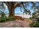 Serene backyard with hanging swing and waterfront view at 2886 Bay Shore Dr, Safety Harbor, FL 34695