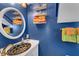 Small bathroom with a unique sink, bright blue walls, and colorful towels at 2886 Bay Shore Dr, Safety Harbor, FL 34695