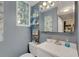 Clean bathroom with updated vanity and shower at 2886 Bay Shore Dr, Safety Harbor, FL 34695