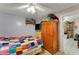 Charming bedroom with wood wardrobe and multicolored quilt at 2886 Bay Shore Dr, Safety Harbor, FL 34695