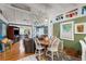 Bright dining area with a round table and four chairs, open to the living room at 2886 Bay Shore Dr, Safety Harbor, FL 34695