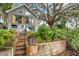 Charming waterfront home with lush landscaping and private stairs leading to the water at 2886 Bay Shore Dr, Safety Harbor, FL 34695
