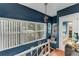 Charming hallway with built-in window seat and blue walls at 2886 Bay Shore Dr, Safety Harbor, FL 34695