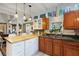 Eat-in kitchen with wood cabinets, green countertops and a breakfast bar at 2886 Bay Shore Dr, Safety Harbor, FL 34695