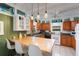 Spacious kitchen with wood cabinets, green countertops, and an island at 2886 Bay Shore Dr, Safety Harbor, FL 34695
