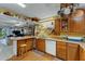 Bright kitchen with wood cabinets, ample counter space, and a view to the living area at 2886 Bay Shore Dr, Safety Harbor, FL 34695